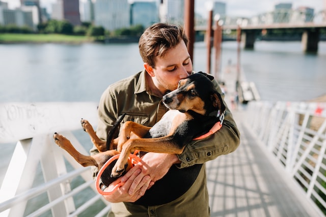 Man holding his dog